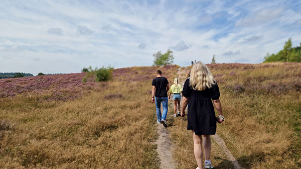 Family walking in the nature reserve next to Landal PUUR Exloo