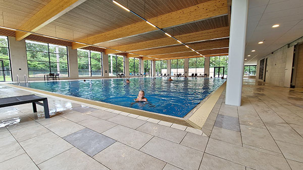 Girl swimming in the swimming pool at Landal Puur Exloo