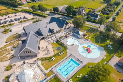 Aerial view of the center and outdoor pool of holiday park Camping Zonneweelde