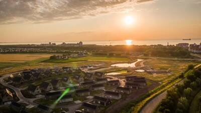 Aerial view of the EuroParcs Cadzand holiday park with the sea in the background