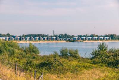 Chalets at the Kraaijenbergse Plassen at holiday park EuroParcs De Kraaijenbergse Plassen