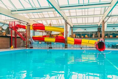 Large slide in the indoor pool of holiday park EuroParcs Zuiderzee