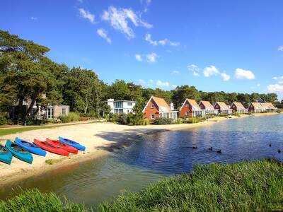Holiday homes and beach on the lake at holiday park EuroParcs de Zanding