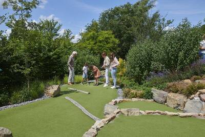 People play golf on the adventure golf course at the Landal Klein Oisterwijk holiday park