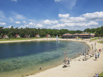 Playground on the beach of the recreational lake of holiday park Landal Landgoed 't Loo