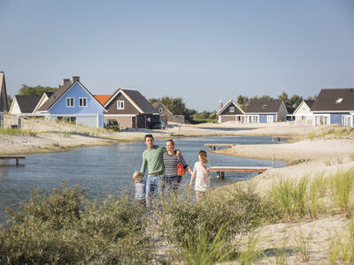 Holiday homes on a water feature with jetties at the Landal Strand Resort Ouddorp Duin holiday park