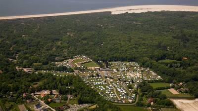Aerial view of holiday park Molecaten Waterbos with the North Sea beach in the background