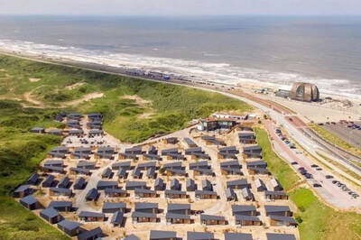 Aerial view of the Roompot Bloemendaal aan Zee holiday park and the North Sea beach