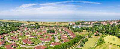 Aerial view of the Roompot Hof Domburg holiday park with the sea on the horizon