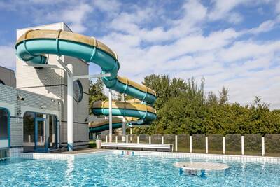 The outdoor pool and large slide at Roompot Holiday Park Hunzedal