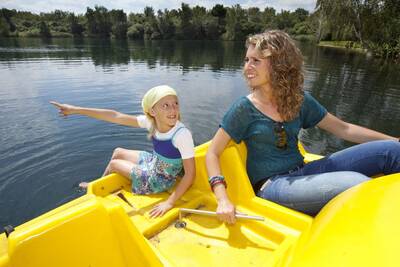 Mother with daughter on a pedal boat at the Roompot Klein Vink holiday park