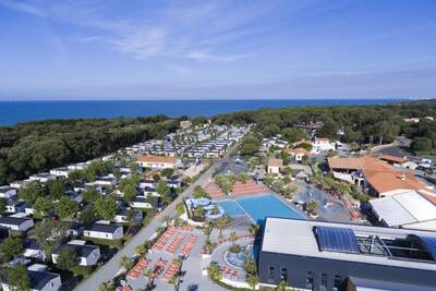 Aerial view of the swimming pool and chalets at the Roompot Le Littoral holiday park