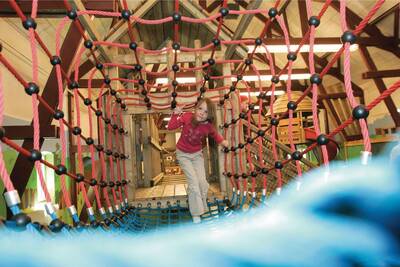 A child plays in the Indoor playground at the Roompot Résidence Klein Vink holiday park