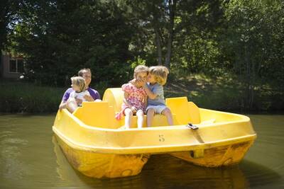 Family on a pedal boat at Roompot Vakantiepark Weerterbergen