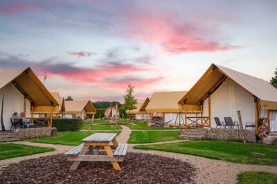 Glamping tents on a field at the EuroParcs Poort van Maastricht holiday park