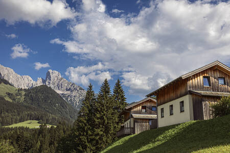 Chalet at Alps Resorts Alpendorf Dachstein West, with mountains behind it