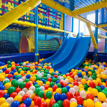 The ball pit with slide in the indoor playground of holiday park BreeBronne