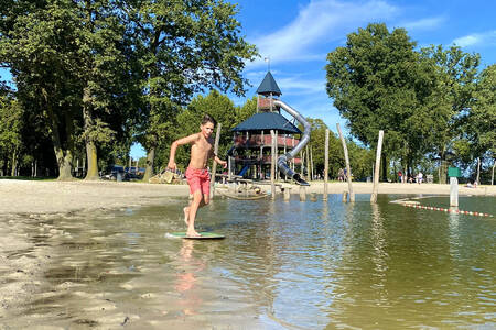 The large play pond next to the swimming pool and the large playground of Buitenhof de Leistert