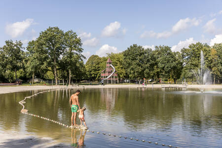 Children can swim and play in the recreational pond with sandy beach at Buitenhof de Leistert