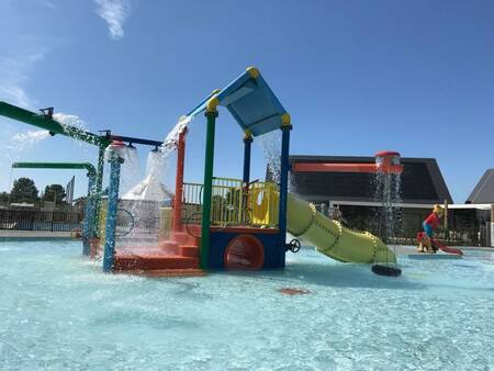 Children playing in the large water playground at Camping Zonneweelde holiday park
