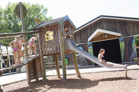 Children playing in a playground at the Camping de Noetselerberg holiday park