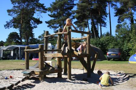 Children playing in a playground at the Camping de Norgerberg holiday park