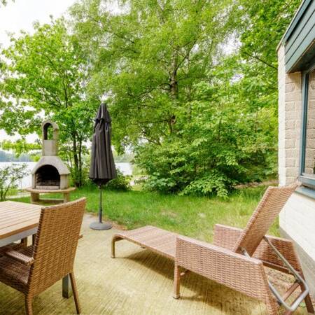 Terrace with barbecue of a holiday home at Center Parcs De Huttenheugte