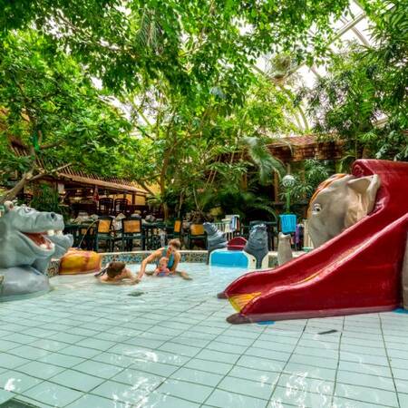 Children play in the children's pool of the Aqua Mundo of Center Parcs De Vossemeren