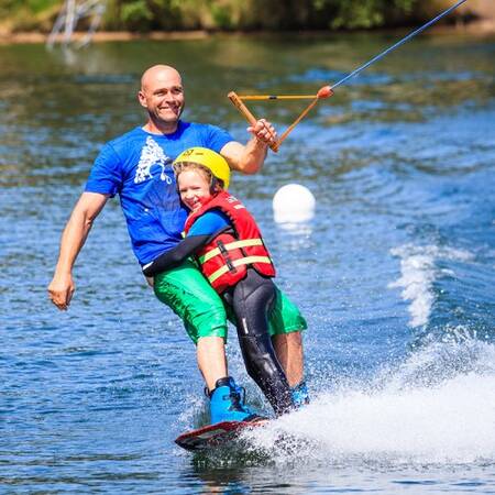 Water skiing on a cable on the park lake of Center Parcs De Vossemeren