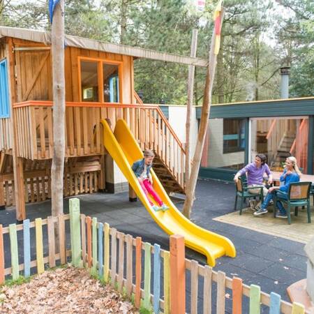 Child-friendly bungalows with playroom and playhut in the garden at Center Parcs Het Meerdal