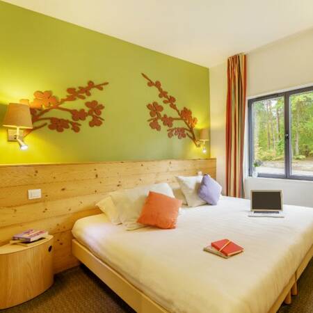 Bedroom with box spring on Center Parcs Les Hauts de Bruyères