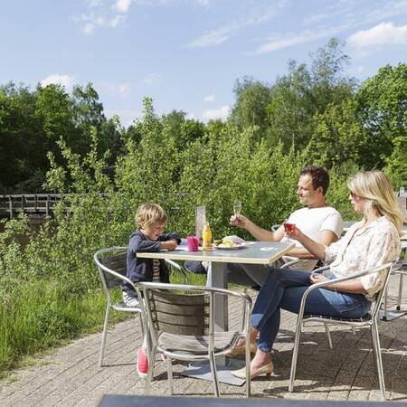 A terrace by the water at Center Parcs Limburgse Peel