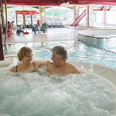 Center Parcs Parc Sandur's swimming pool has a hot tub