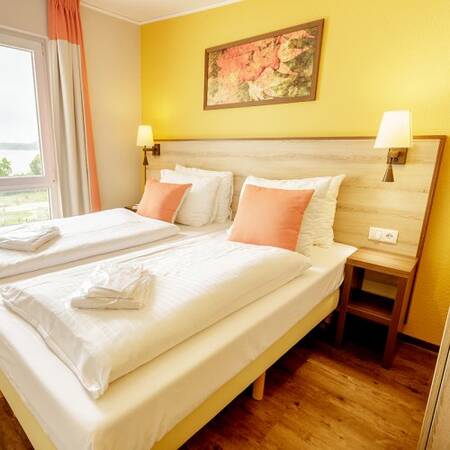 Bedroom with luxury box springs at Center Parcs Park Bostalsee