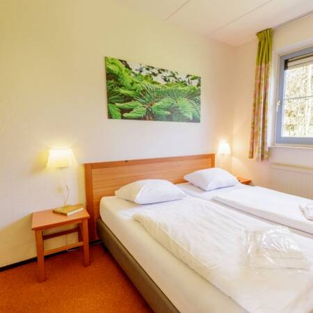 One bedroom in an accommodation at Center Parcs Park Eifel