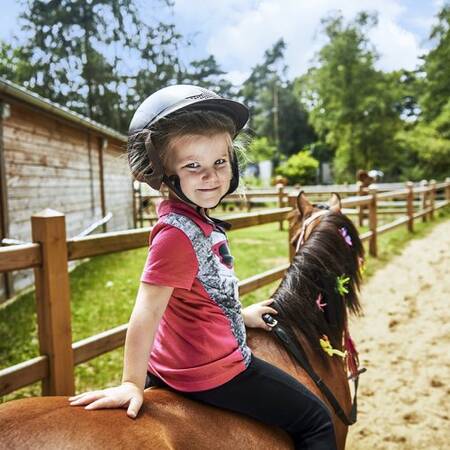 Girl on pony at Center Parcs Park Eifel