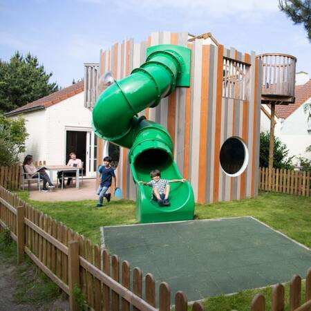 Children's bungalow with its own play equipment at Center Parcs Port Zélande