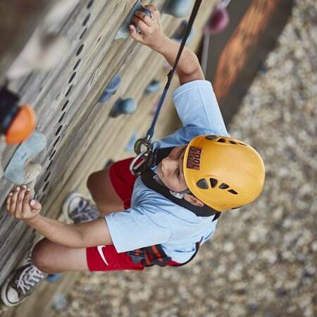 Securely climb up the climbing wall at Center Parcs Port Zélande