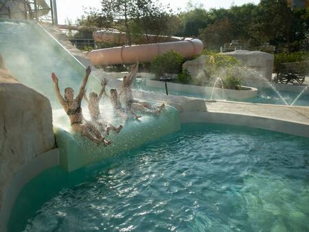 Outdoor pool with slide of the Aqualagon of Center Parcs Villages Nature Paris