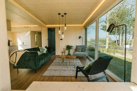 Living room of a holiday home at holiday park De Klepperstee