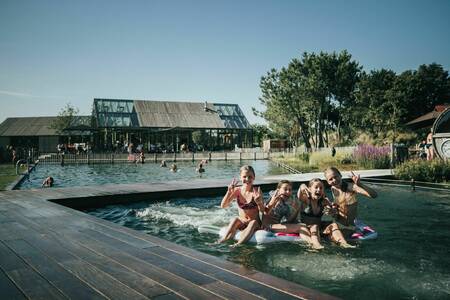 Swimming in the natural pond at holiday park De Klepperstee