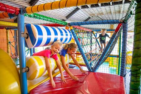 Children play in the indoor playground "Happy Heintje" of camping site De Witte Berg
