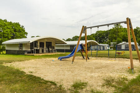 Playground between the tent villas at camping De Witte Berg