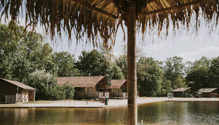 Lodge tents on the water at the Dierenbos holiday park