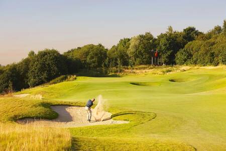 Man on the 27-hole golf course "International Golf Maastricht" next to Dormio Resort Maastricht