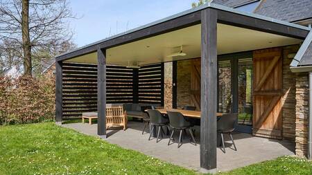 A covered terrace of a holiday home at the Dormio Resort Maastricht holiday park