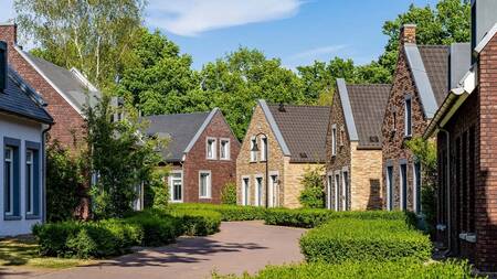Luxury holiday homes on an avenue at the Dormio Resort Maastricht holiday park