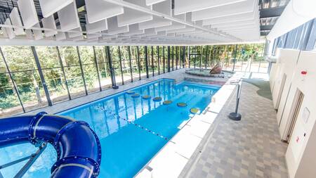The indoor pool with slide of holiday park Dormio Resort Maastricht