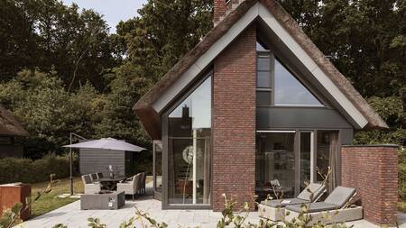 Luxury holiday home with garden furniture in the spacious garden at Dutchen Villapark Mooi Schoorl