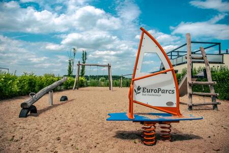 Play equipment in a playground at holiday park EuroParcs Bad Hulckesteijn